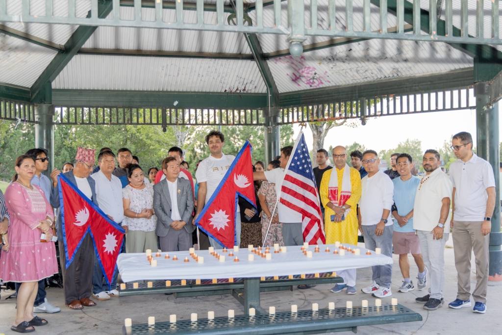 GBCC community candlelight vigil and prayer gathering with Nepal and United States flags